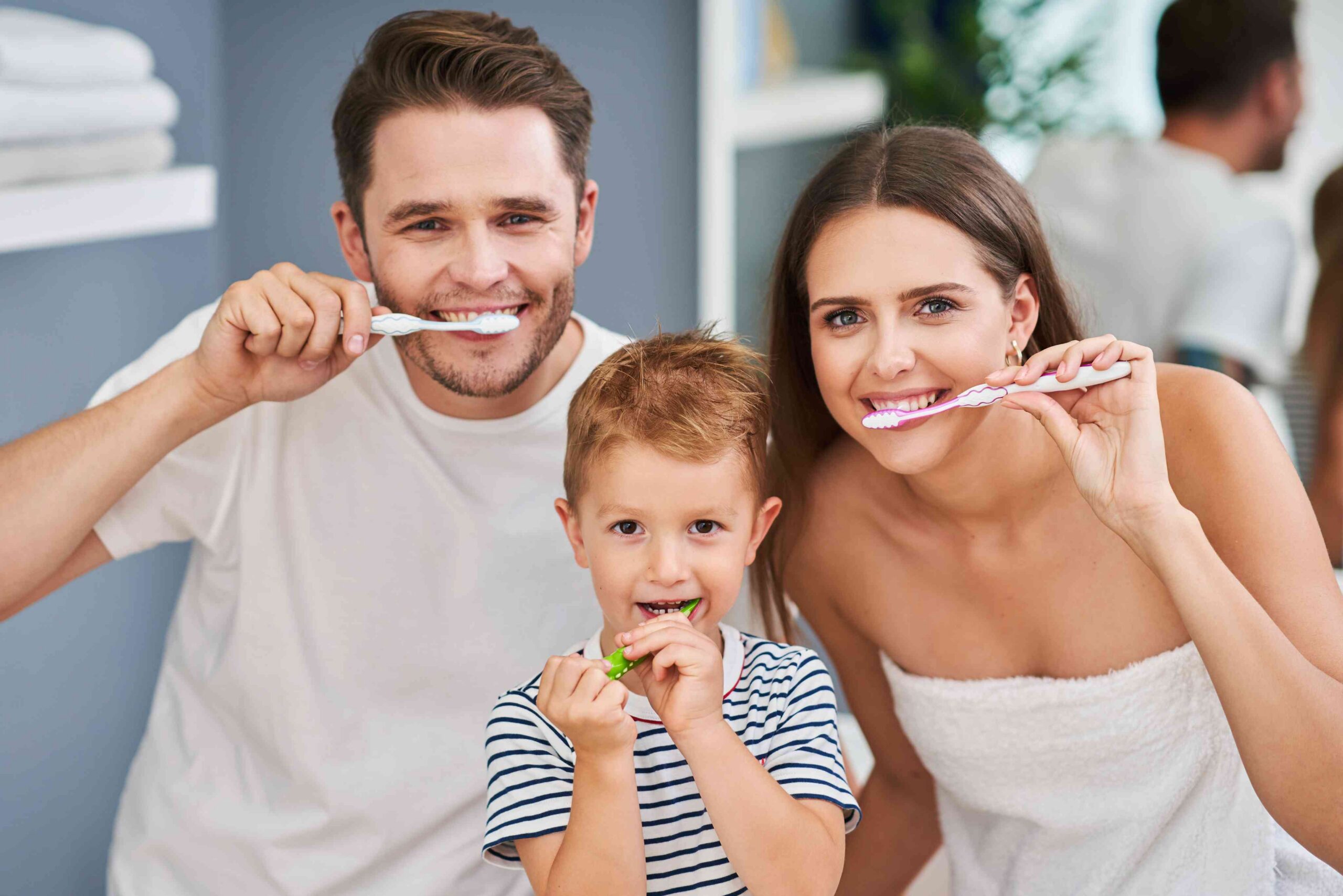 Family brushing their teeth together.