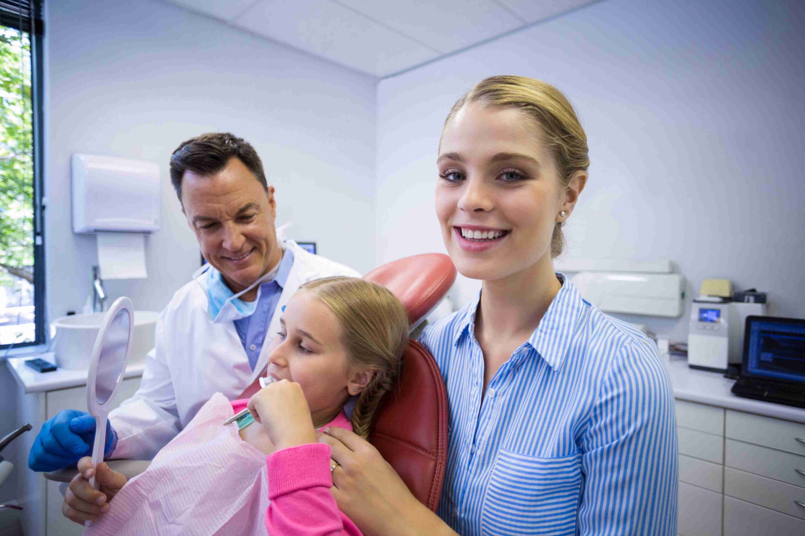 Child patient with parent during a dental visit.