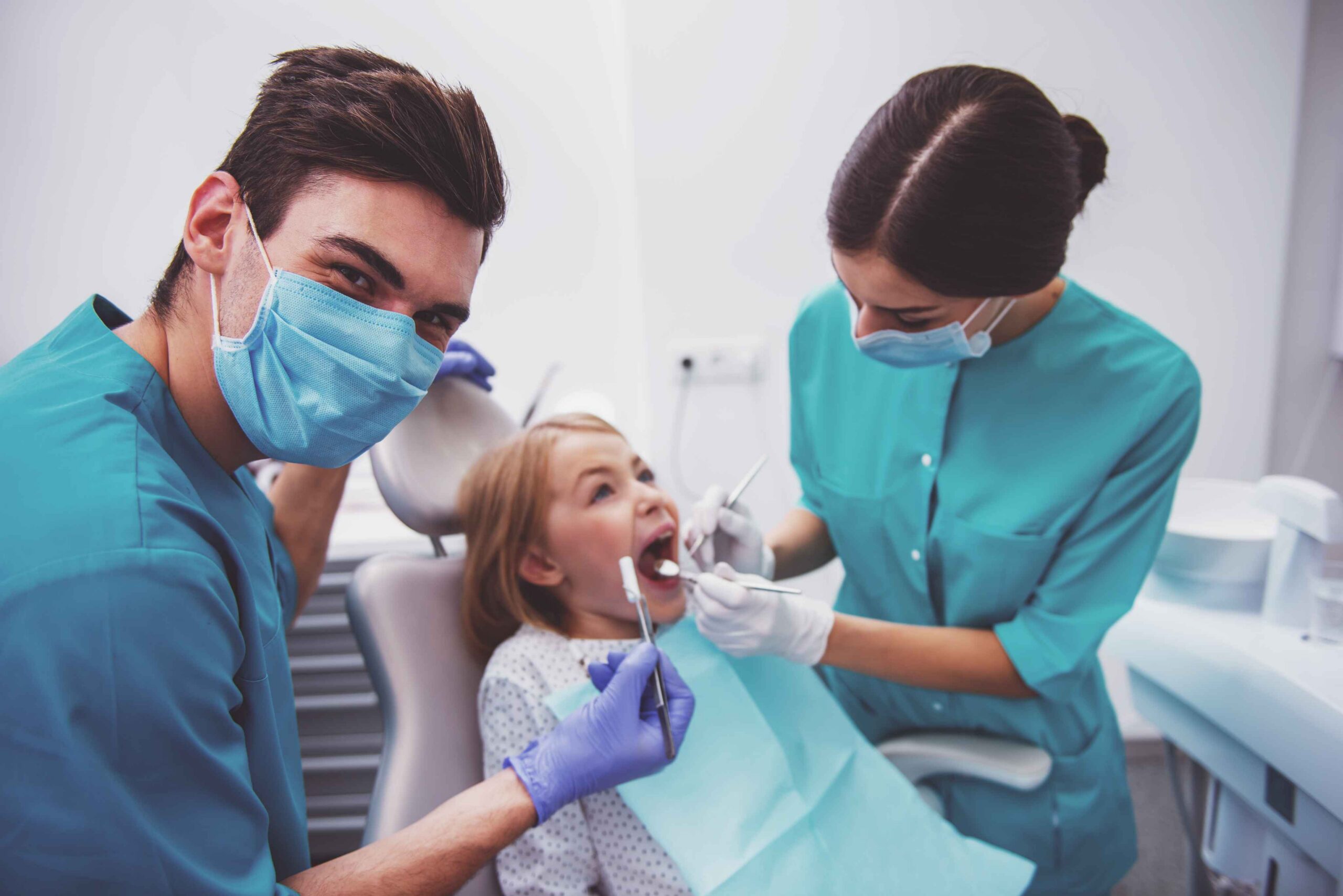 Child receiving gentle dental exam.